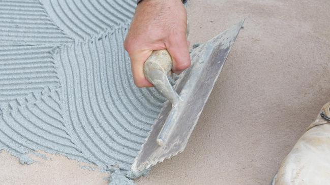 HOME - DIY stone pebbles part 2 with Joe Bagnara - laying pebbles and grouting - step 4 spread ceramic tile adhesive with a notched trowel