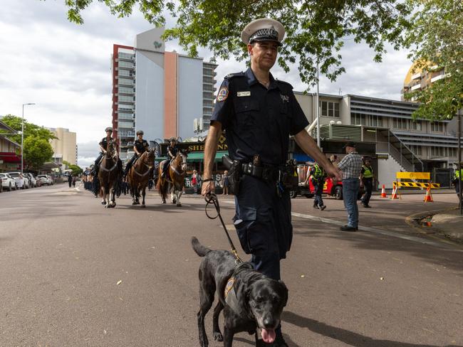 Constable Luke Lamb marching with his canine. Picture: Floss Adams.