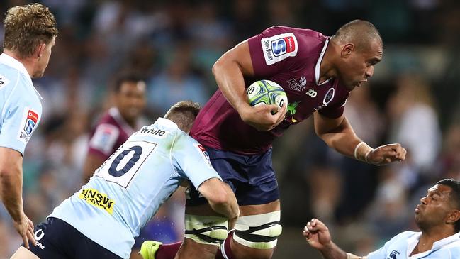 SYDNEY, AUSTRALIA — APRIL 14: Lukhan Tui of the Reds is tackled by the Waratahs defence during the round nine Super Rugby match between the Waratahs and the Reds at Sydney Cricket Ground on April 14, 2018 in Sydney, Australia. (Photo by Brendon Thorne/Getty Images)