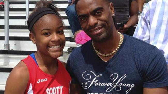 Trinity Gay, 15, pictured with her Olympic sprinter father Tyson Gay, was fatally shot in the neck in Kentucky, USA recently. (Pic: AP)