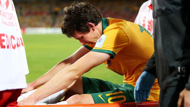 A shattered Robbie Kruse leaves the field on a stretcher.