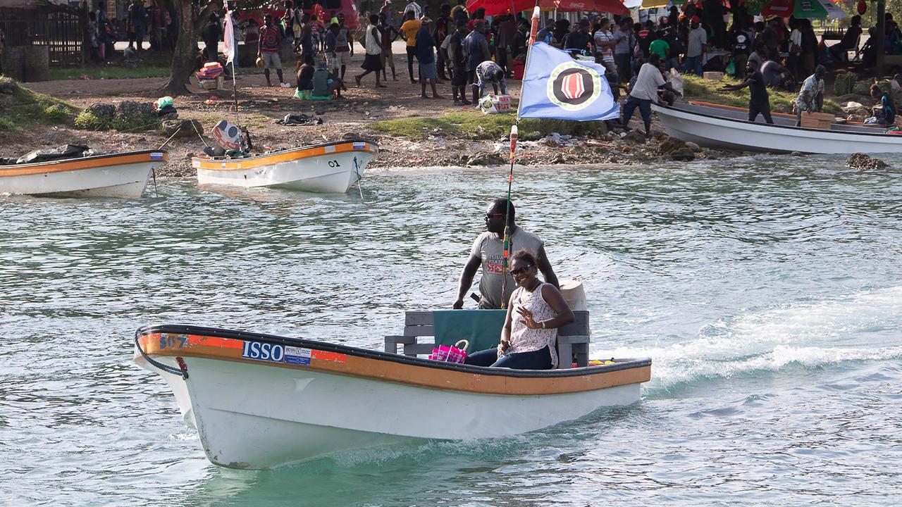 A boat flying the Bougainville flag in the capital Buka. Picture: Ness Kerton/AFP
