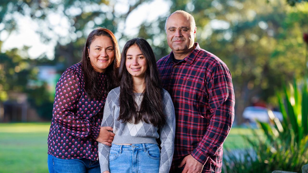 Dany and Cynthia Elachi, with their daughter Aalia, 14. Aalia is not allowed social media or a phone. Picture: Justin Lloyd