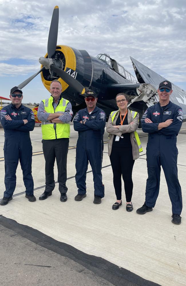 Glenn Graham, Trevor Willcock, Paul Bennett, Sarah Gilmore, Matt Henderson pose in front of a TBM Grumman Avenger ahead of the 2024 Mildura Air Show. Picture: Stuart Kavanagh