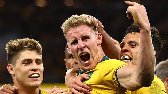 PERTH, AUSTRALIA - AUGUST 10: Reece Hodge of Australia (C) celebrates his try during the 2019 Rugby Championship Test Match between the Australian Wallabies and the New Zealand All Blacks at Optus Stadium on August 10, 2019 in Perth, Australia. (Photo by Cameron Spencer/Getty Images)