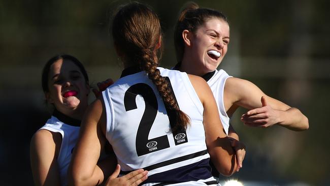 Northern Knights players celebrate a goal.