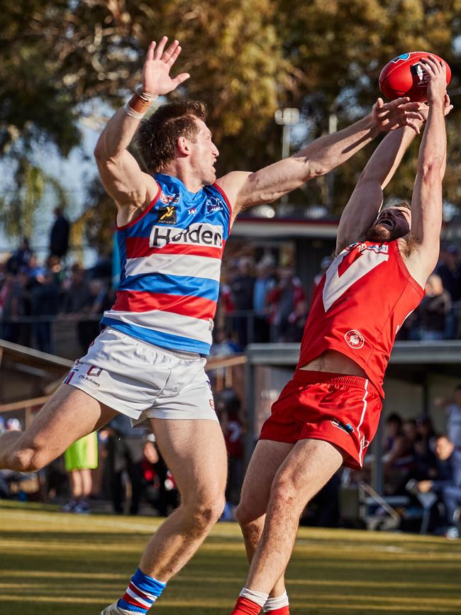 North Adelaide's Max Thring marks in front of Central District's Trent Goodrem. Picture: MATT LOXTON