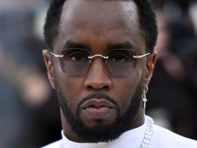 (FILES) Sean Combs 'P. Diddy' arrives for the 2018 Met Gala on May 7, 2018, at the Metropolitan Museum of Art in New York. Music mogul Sean Combs is set to go on trial for racketeering and sex trafficking on May 5, 2025, a judge said in a court hearing October 10, 2024. The rapper known as "Diddy" will remain incarcerated, said federal judge Arun Subramanian, after he was indicted last month on three criminal counts that allege he sexually abused women and coerced them into drug-fueled sex parties using threats and violence. (Photo by ANGELA WEISS / AFP)