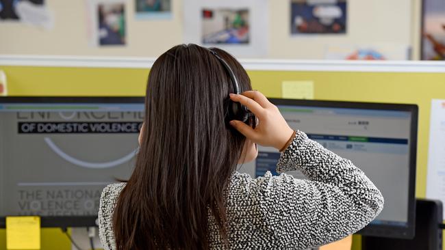 A Domestic Violence Crisis Line call centre worker. Photo: Naomi Jellicoe