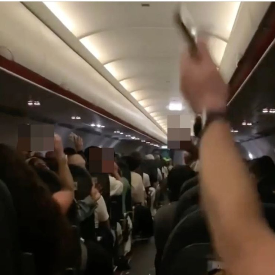This is the shocking moment rowdy Brit passengers disrupt a flight from London to Ibiza. Picture: Solarpix