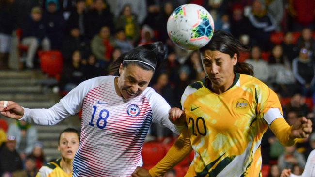 Australia’s Sam Kerr, right, battles with Chile defender Camila Saez in Adelaide