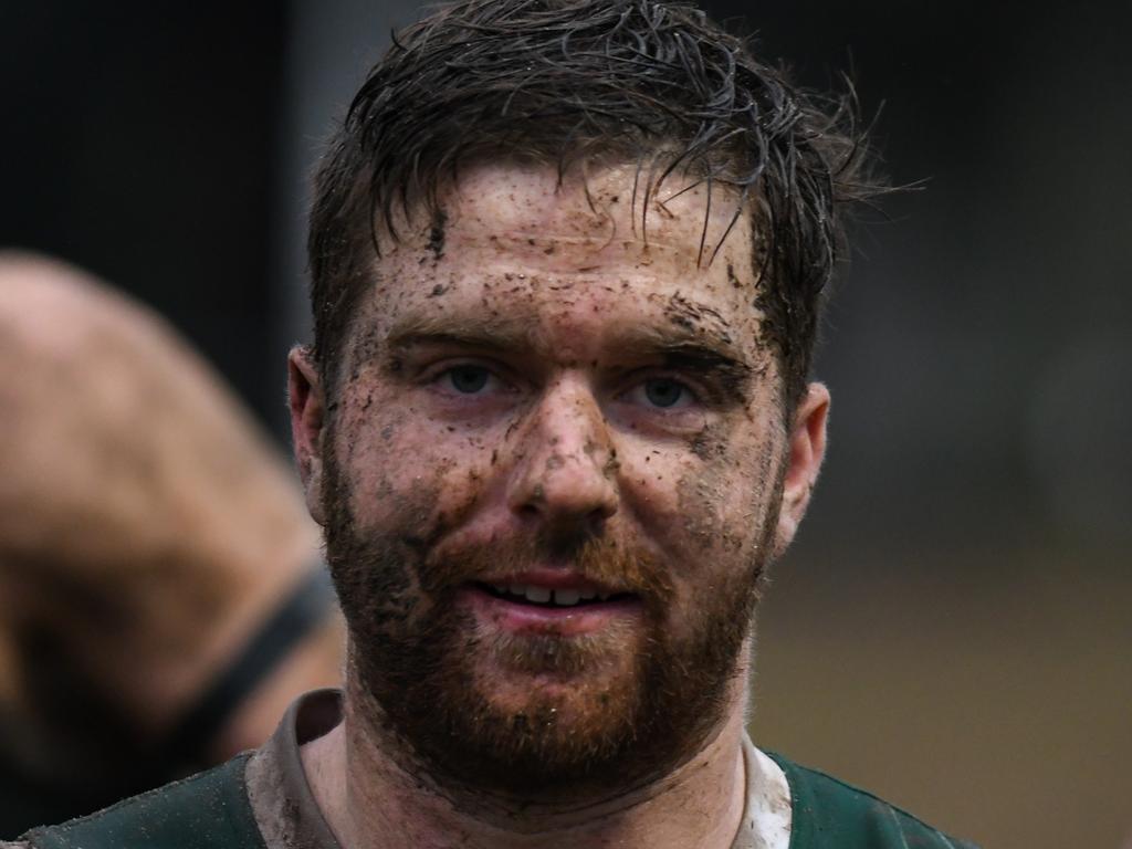 This Greensborough player needed a good shower after his side’s win over Macleod. Pictures: Nathan McNeill.