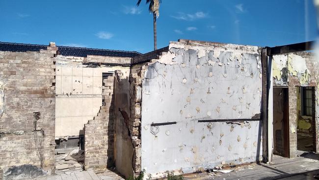 A burnt house on the same street with no roof set jaws dropping when it went to auction in 2020.