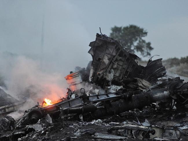 Flames among the wreckage. Picture: AFP / DOMINIQUE FAGET