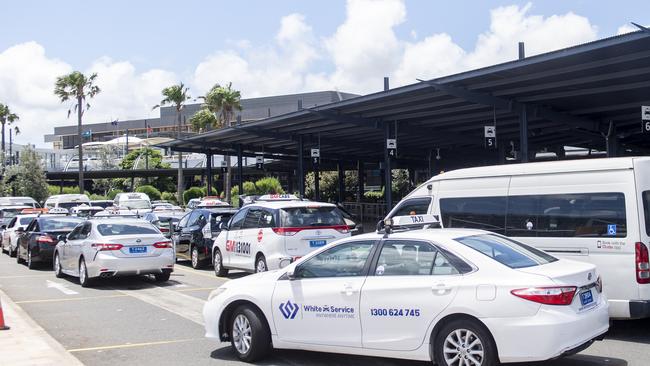 Returning passengers at the Sydney International Airport Taxi rank. Photo Jeremy Piper