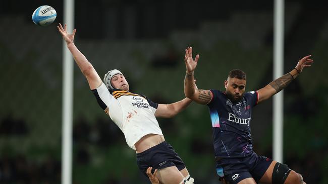 Nick Frost of the Brumbies and Lukhan Salakaia-Loto of the Rebels compete in a line out.