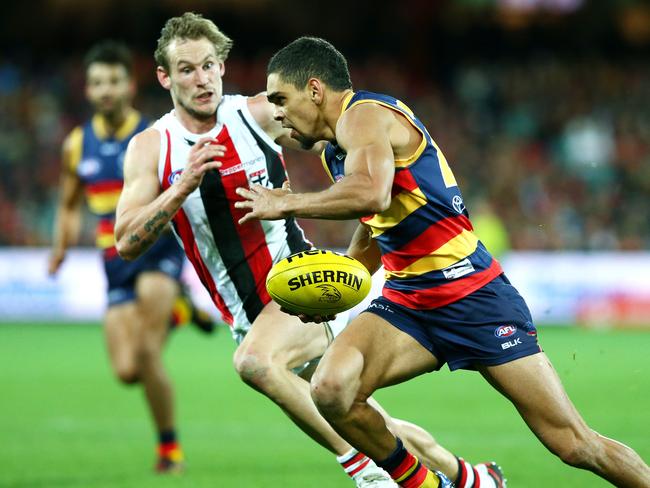 Adelaide goalsneak Charlie Cameron evades Jimmy Webster last Sunday. Picture: Sarah Reed