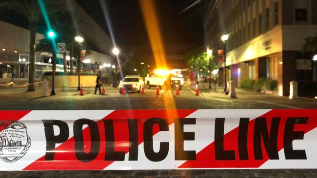 Police tape in downtown Jacksonville, Florida, where two people were killed and 10 others wounded. Picture: Gianrigo Marletta / AFP