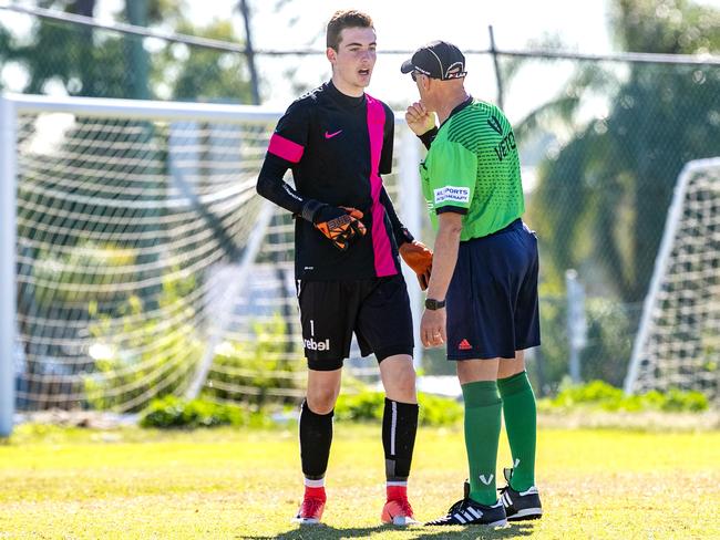 Kasper Stockill with referee Jim Bellos in the Queensland Schools Premier League Football match between Marsden and Corinda at Darra, Thursday, July 30, 2020 - Picture: Richard Walker