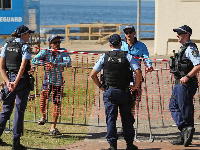 Police and lifeguards pictured at Clovelly Beach in Sydney.The public has been asked to adhere to the strict social distancing guidelines put in place by the government to combat the spread of Covid-19.Picture: Richard Dobson