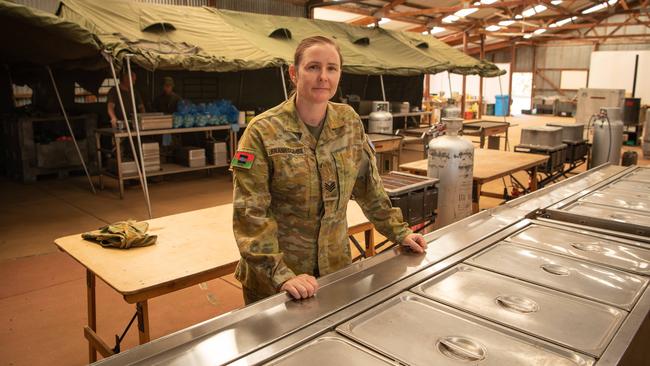 Sgt Letiescha Frankcombe preparing meals in the makeshift kitchen at Parndana football club. Picture: Brad Fleet