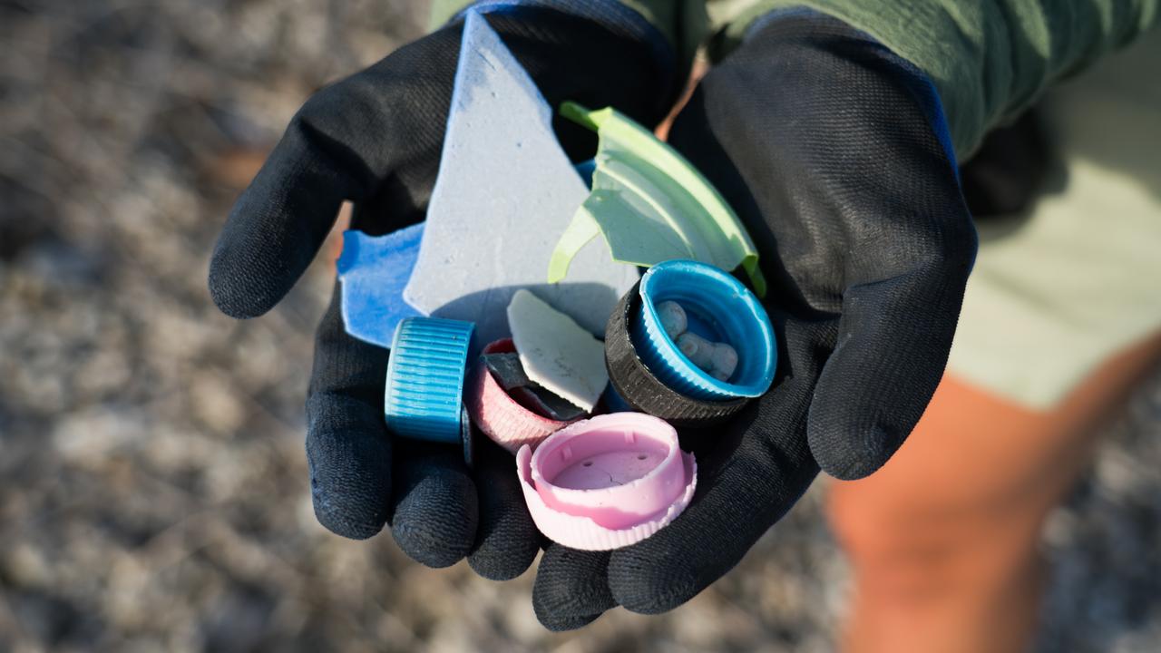 Lids from drink bottles and other plastic fragments. Source: Sam Boynton for Corona/Parley/National Geographic