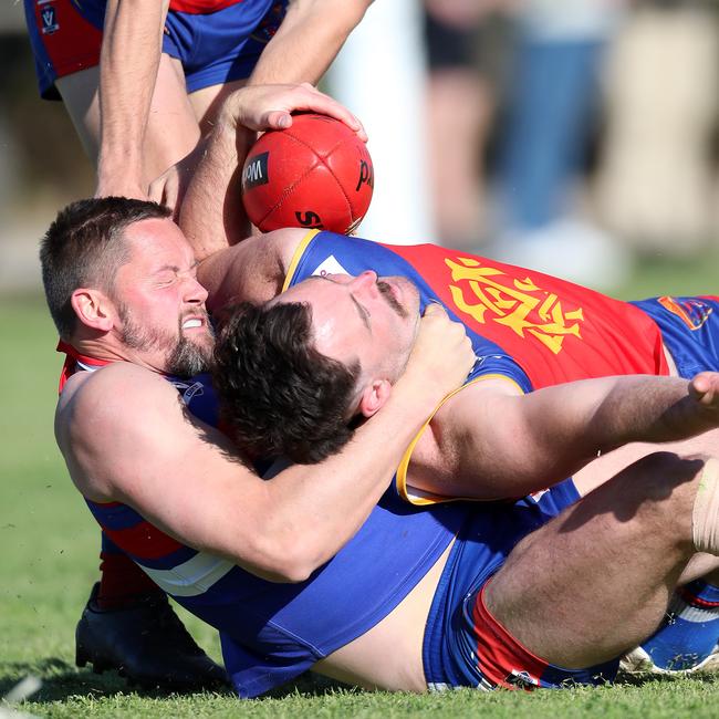 Pyramid Hill’s Tom Brennan tackles a Marong opponent. Picture Yuri Kouzmin