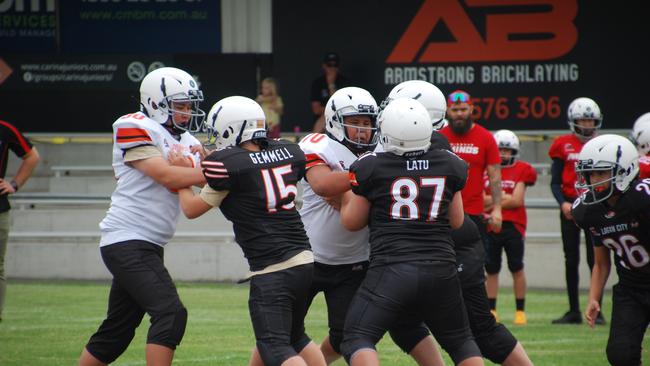 Vahaki Latu blocking the line.