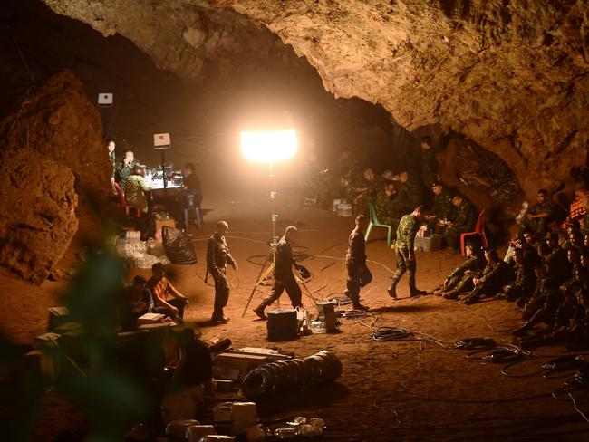 Thai soldiers gather in Tham Luang cave at the Khun Nam Nang Non Forest Park in Chiang rai on June 26 as their rescue mission continued. Picture: AFP