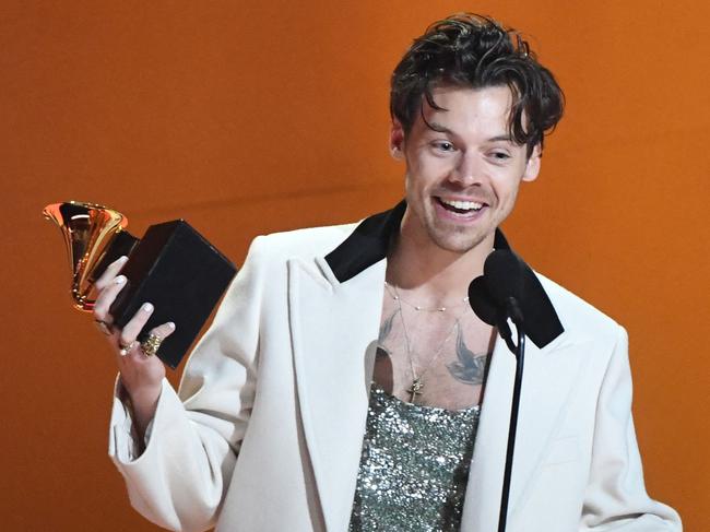 English singer-songwriter Harry Styles accepts the award for Album Of The Year for "Harryâs House" during the 65th Annual Grammy Awards at the Crypto.com Arena in Los Angeles on February 5, 2023. (Photo by VALERIE MACON / AFP)