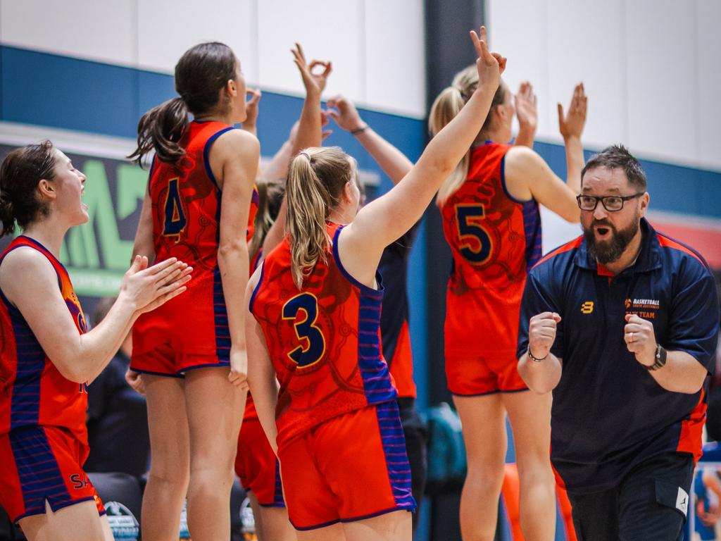 South Australia Red players and coach Richard Dickel celebrate during the Basketball Australia Under-20 National Championships. Picture: Tayor Earnshaw