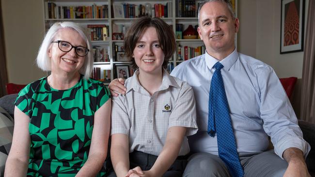 Teen Parliament student Toby with their parents Michele and Eoin McEvoy. Picture: Ben Clark