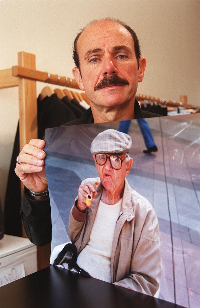 A 2003 picture of Ron Benscher of Bondi Junction, Sydney, holding photograph of his murdered father.