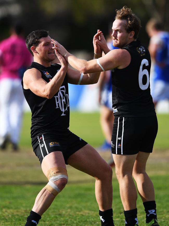 James Batty celebrates a kicking a goal during the match between Port District and St Peter's Old Collegians. Picture: AAP/Mark Brake