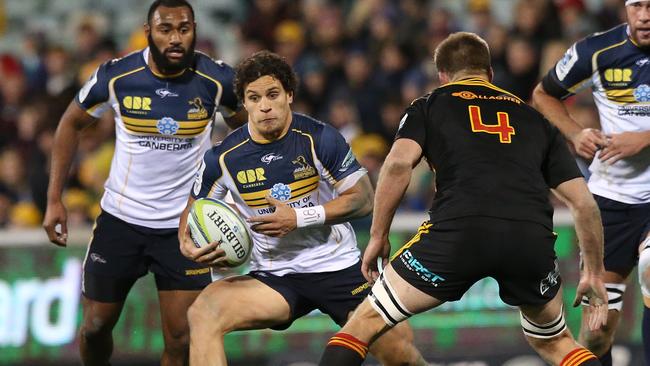 Brumbies flyhalf Matt Toomua takes on the Chiefs defence.