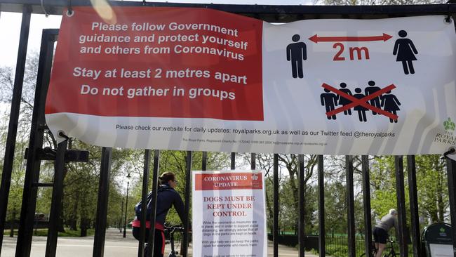 A sign at London’s Hyde Park advises of social distancing measures. Picture: AP