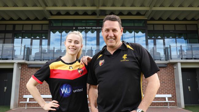 Goodwood Saints Football Club President Craig Scott, with the women’s team vice-captain Madelyn Griffiths out the front of the new multimillion-dollar grandstand at Goodwood Oval. Picture: Emma Brasier