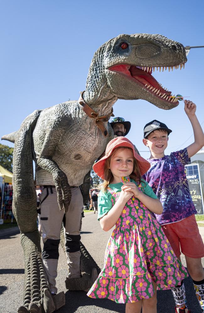 Grace and Peter Ackroyd with Blue from the Dinosaur Adventure Park at the Toowoomba Royal Show, Friday, April 19, 2024. Picture: Kevin Farmer