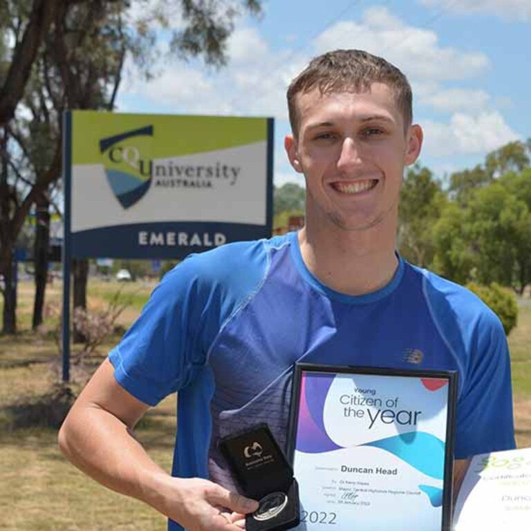 Picture: Duncan Head accepting the recognition while pictured outside a CQU Australia campus (supplied).