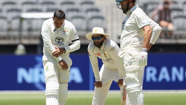 Usman Khawaja of Australia reacts after being struck (Photo by Paul Kane/Getty Images)