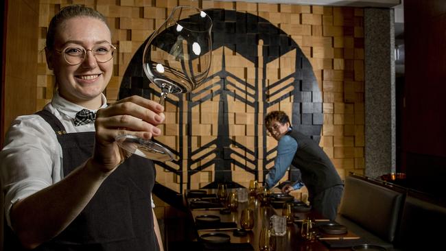 The Star Gold Coast workers Emily Berry and Matthew Tran setting tables in Kiyomi. The restaurants “are looking beautiful” after downtime in the COVID-19 crisis. Picture: Jerad Williams