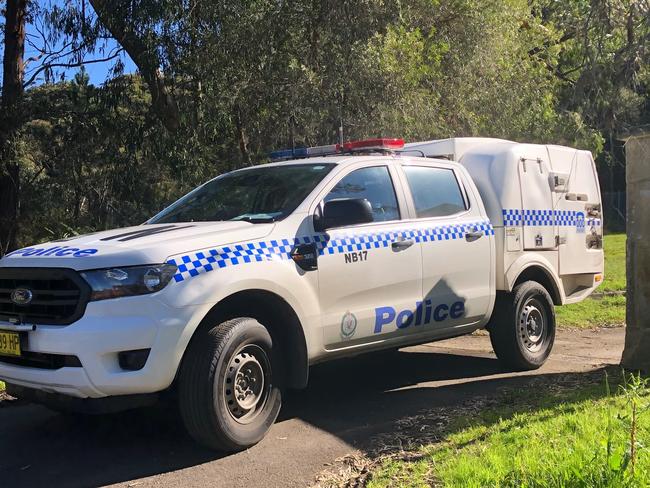 Police take Malcolm Berkeley from the Hilversum Cres property after he attacked police and had to be tasered. Picture: Jim O'Rourke