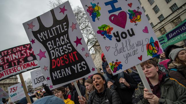 LONDON, ENGLAND - JANUARY 21:  Women's rights demonstrators hold placards and shout slogans during the Time's Up rally at Richmond Terrace, opposite Downing Street on January 21, 2018 in London, England. The Time's Up Women's March marks the one year anniversary of the first Women's March in London and in 2018 it is inspired by the Time's Up movement against sexual abuse. The Time's Up initiative was launched at the start of January 2018 as a response to the #MeToo movement and the Harvey Weinstein scandal.  (Photo by Chris J Ratcliffe/Getty Images)