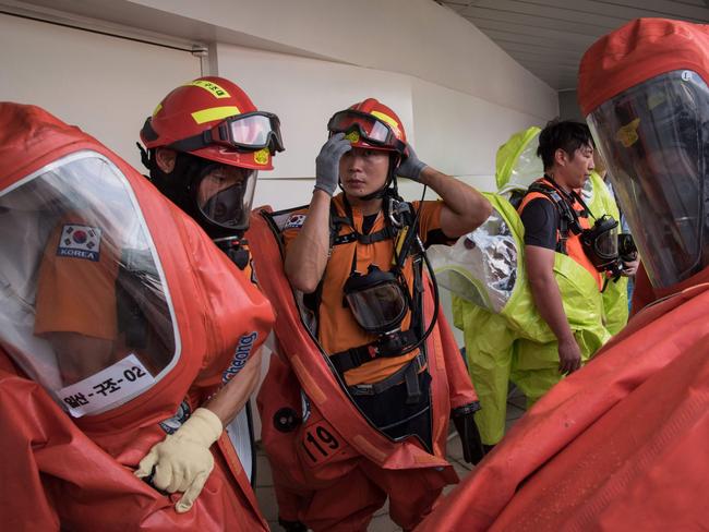 Emergency service members take part in an anti-terror drill as South Korea’s military leader vows support for the Kill Chain system of defence. Picture: AFP PHOTO / Ed JONES