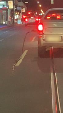 Ute speeds off with petrol pump still attached to car