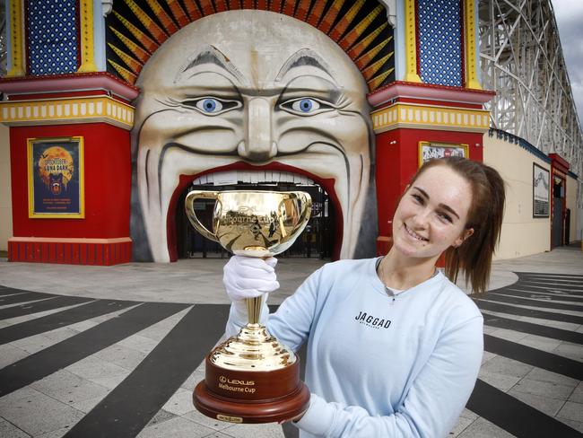 Lauren Hutchinson holds the Cup outside Luna Park in St Kilda. Picture: David Caird