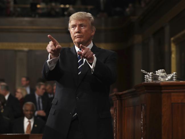 President Donald Trump acknowledges applause after addressing a joint session of Congress. Picture: AFP