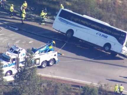 A horror bus crash in the Hunter Valley over night has claimed 10 lives with many more in hospital.  The bus is righted with a tow truck. Must Credit: 9 News