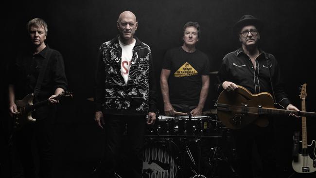 Midnight Oil release Rising Seas; and pay tribute to lost brother Bones Hillman with his bass (far right). Picture: Supplied / Robert Hambling