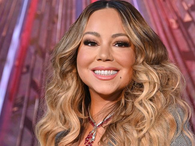 (FILES) In this file photo taken on December 17, 2019, US singer Mariah Carey participates in the ceremonial lighting of the Empire State Building in celebration of the 25th anniversary of "All I Want For Christmas Is You" in New York City. - Carey has been sued in the US for alleged copyright infringement over her 1994 global hit "All I Want for Christmas Is You," court documents show. The plaintiff, Andy Stone, says he co-wrote and recorded a festive song of the same name in 1989 and never gave permission for it to be used. In the suit filed on June 3, 2022, in Louisiana, Stone alleges that Carey and her co-writer Walter Afanasieff "knowingly, willfully, and intentionally engaged in a campaign to infringe" his copyright. He is seeking damages of $20 million for alleged financial loss. (Photo by Dia DIPASUPIL / AFP)